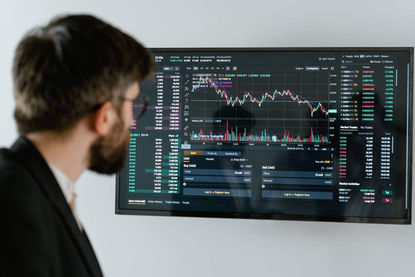 Trader watching market screens